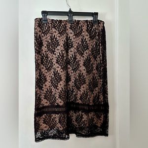 Barney’s black lace skirt